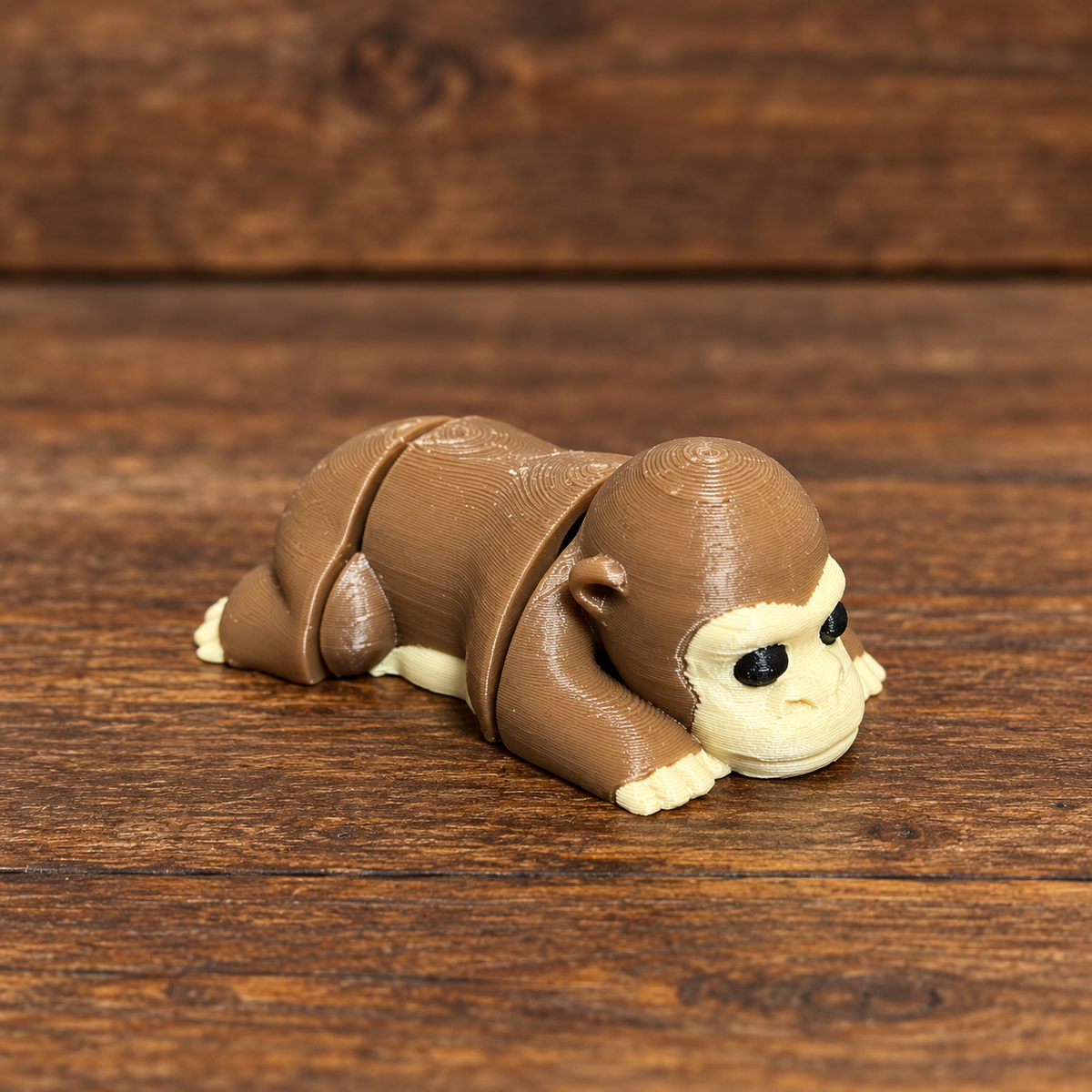 3D printed Little Critters toy on rustic wood background