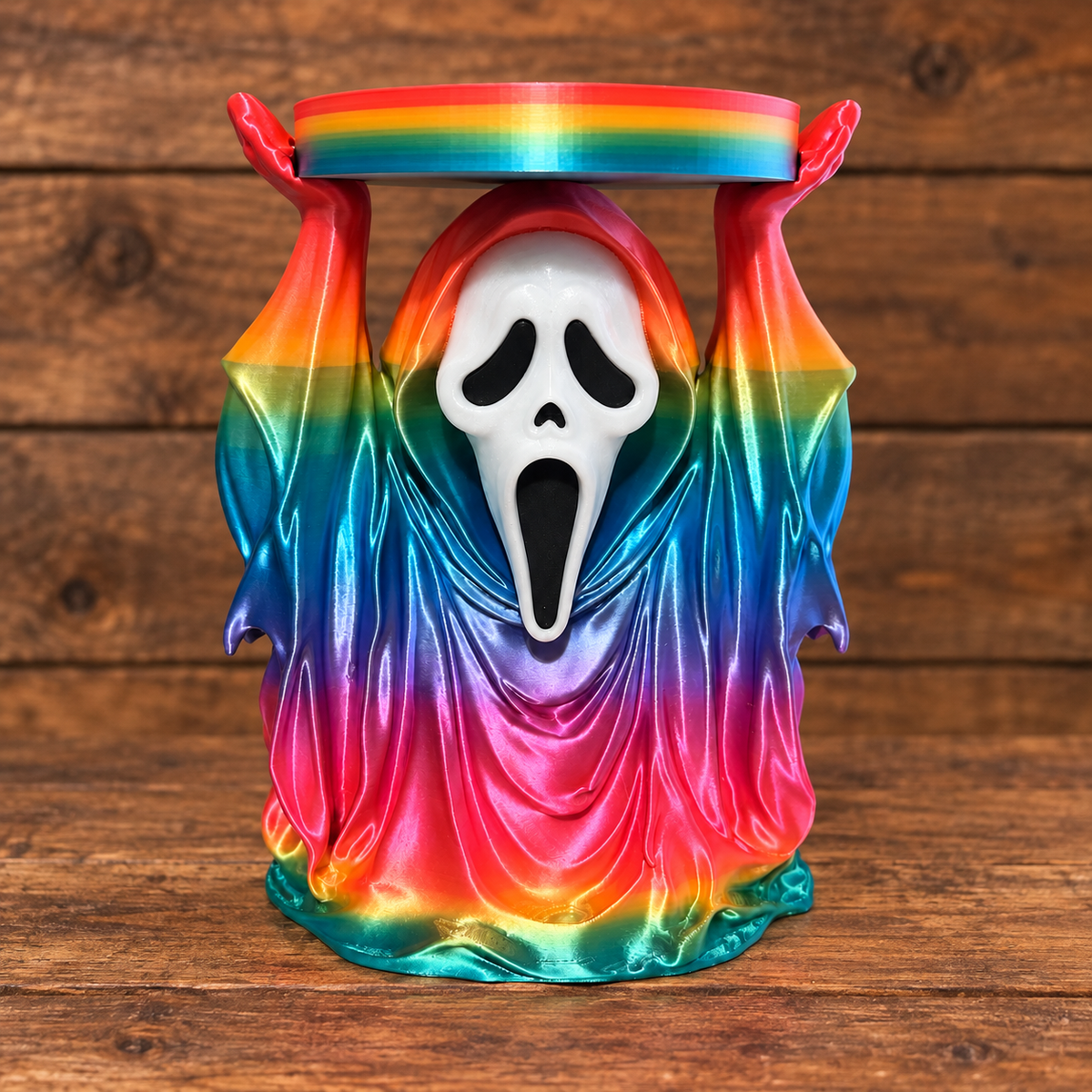 3D printed Spooky Mask candle holder on rustic wood background