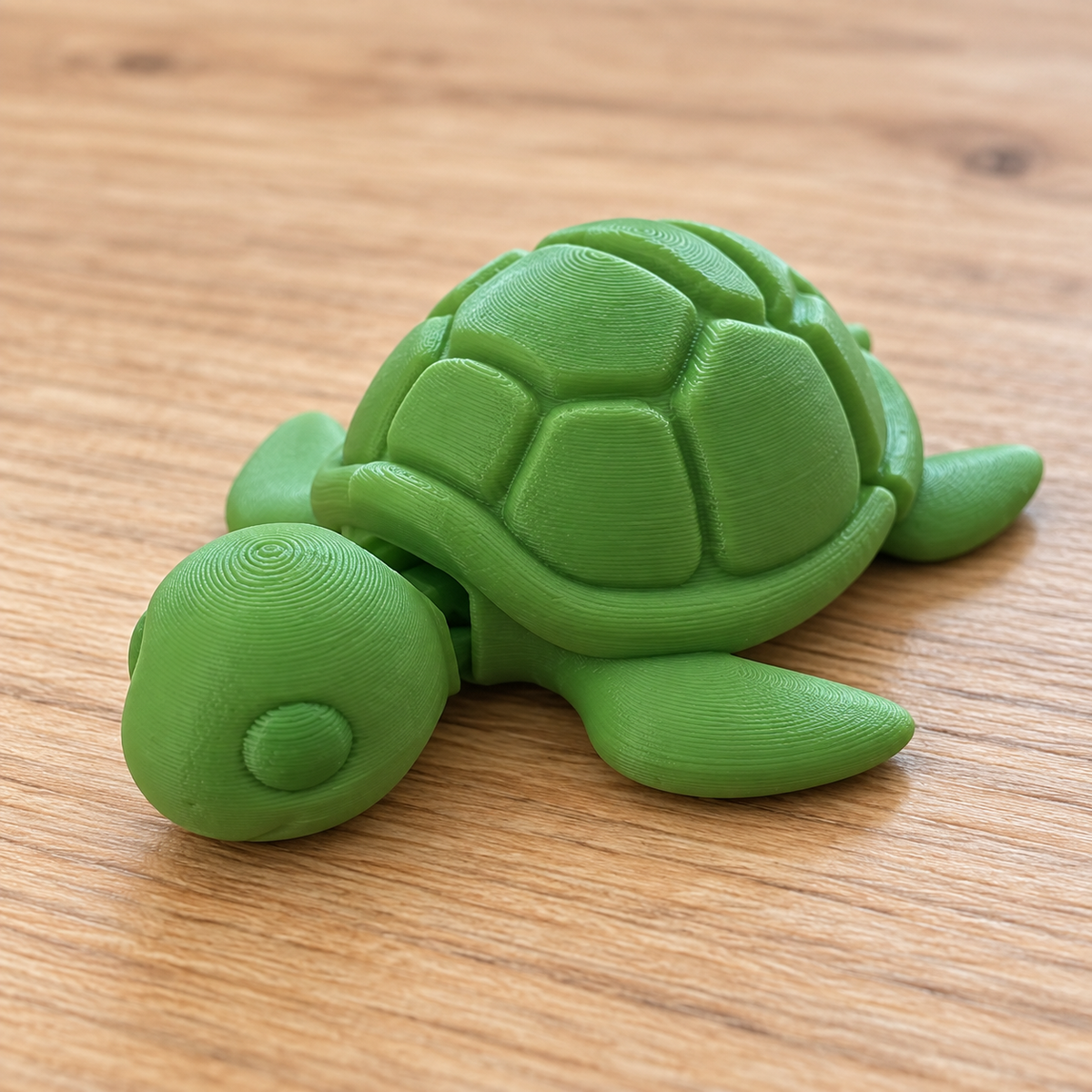 Solid green Flexi Turtle with matching green eyes on light wood